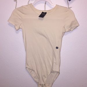 Cream colored bodysuit